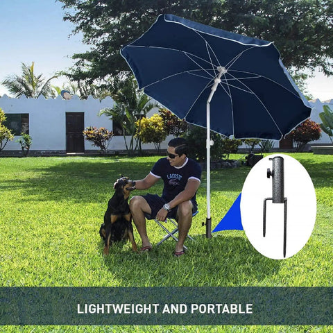 Person sitting under umbrella with Adjustable Portable Umbrella Base With Heavy Duty Metal Holder Stand Auger for Sand Grass Flag