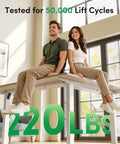 Dope Ergonomic L Shaped Standing Desk Adjustable Height Electric Sit Stand Corner Computer Workstation with two people seated.
