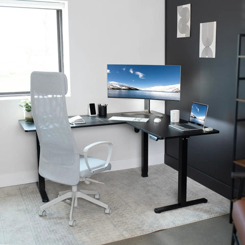 Corner Standing Desk With Electric Height Adjustment 63 X 55 Inch Reversible L Shaped Workstation in home office setup
