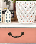 Vintage Zinc Alloy Cabinet Pull Handles 4 Pack for Furniture Doors and Drawers on pink drawer front with decor items