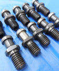 Pro Shop Ready Cat40 Coolant Thru Tool Holder Lot featuring rugged pull studs laid out on a blue surface.