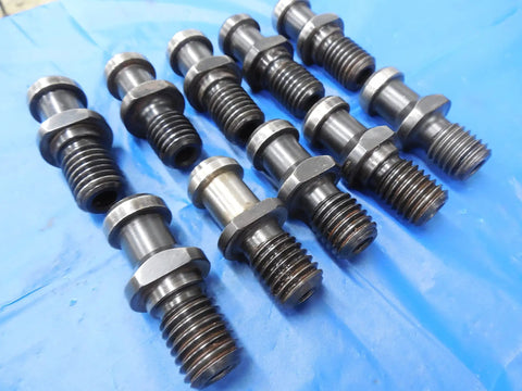 Pro Shop Ready Cat40 Coolant Thru Tool Holder Lot featuring rugged pull studs laid out on a blue surface.