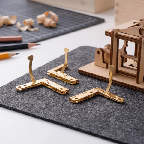 Set Of 20 Gold Lid Support Hinges For Wooden Jewelry Boxes, 92 Degree Quadrant Folding Hardware on grey felt mat