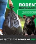 Person holding heavy-duty black Rodent-Repellent Trash Bags With Drawstring And Mint-Flex Technology, 33 Gallon for outdoor use.