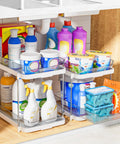 Super Handy Two Tier Under Sink Organizers And Bathroom Storage Solutions For Cabinets And Kitchen Pantries With Smooth Slide Out Drawers And Fully Adjustable Dividers In Bright White Two Pack holding cleaning supplies.