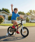 Child riding Lomand 16 Inch Kids Bike With Training Wheels For Boys And Girls Ages 4 To 7, BMX Style Bicycle in gray, outdoors.