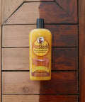 Bottle of Sun Shield Wood Wax With UV Protection For Outdoor Furniture Gallon, showing effect on wooden surface.