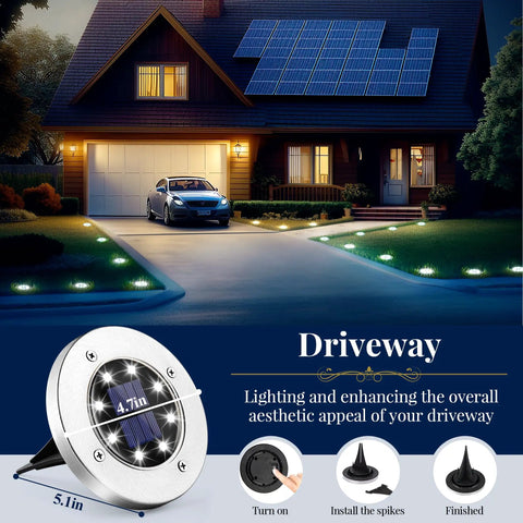 Eight LED Solar Ground Lights Outdoor Waterproof Kit illuminating driveway with cool white glow at night next to house.
