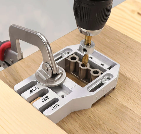 Joint Master Doweling Jig With Self-Clamping Aluminum Frame for Edge, Corner and Surface Joints, drilling on wooden surface.