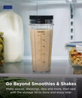 Heavy Duty Personal Blender Featuring 900W Push To Blend Motor And Pro Extractor Blades Crushing Ice For Nutrient Dense Smoothies Including Three Grab And Go 20 Oz Serveware Cups In Classic Silver in fridge with smoothie.