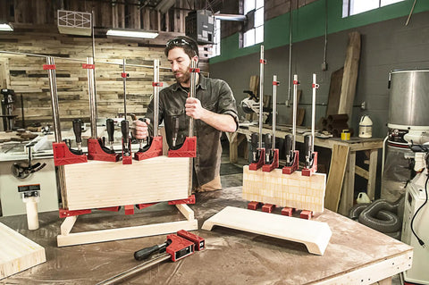 24 Inch Woodworking Parallel Clamp that cranks up 1000 lbs of clamping pressure in use, workbench setup