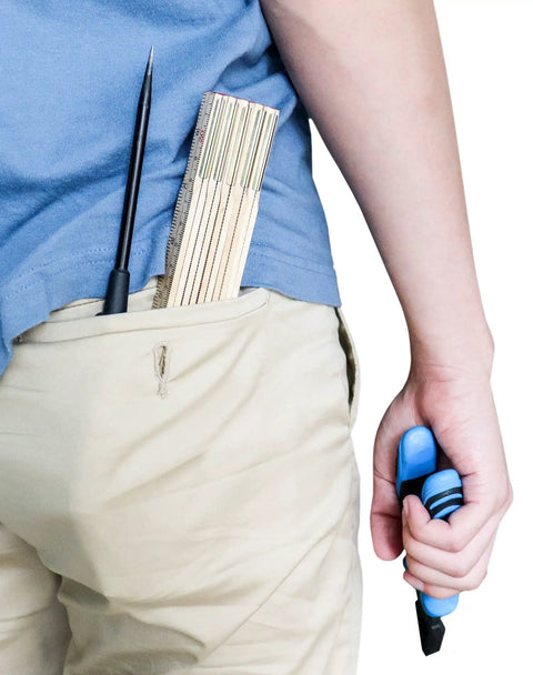Person carrying Two Pack Folding Wood Rule 6 Ft 6 In Ruler With US And Metric Measurements in back pocket, holding tools