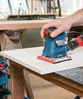 Person using GSS20-40 One Quarter Sheet Orbital Finishing Sander, Palm Sized, 2 Amp Motor, 12,000 OPM on wood surface