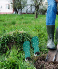 Garden Aerator Shoes With Adjustable Straps And Non Slip Spikes For Lawn Aeration And Yard Soil Health near person on grass