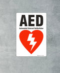 AED sign, 7x10 inches, white vinyl label with black AED text and red heart with white lightning bolt