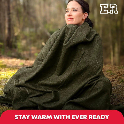 Woman wrapped in Olive Drab Green Fire Retardant Wool Blanket 66 By 90 Inch Beefy Heavy Duty Military Style 80 Percent Wool 2 Pack