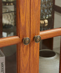 Close-up of dark oak finish and tempered glass doors on 32 Inch LED Accent Curio Cabinet With Seven Color Lights For Collectibles.