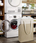 Two-Pack Slim Laundry Hampers Set In Beige And Khaki, Collapsible Linen-Like Fabric Baskets next to washing machine