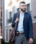 Man carrying bag wearing Grab And Go Coin Pouch With Belt Clip And Carabiner For Easy Access Mini Wallet Change Holder