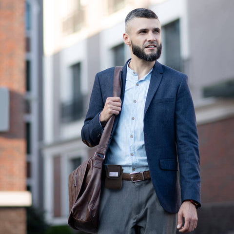 Man carrying bag wearing Grab And Go Coin Pouch With Belt Clip And Carabiner For Easy Access Mini Wallet Change Holder