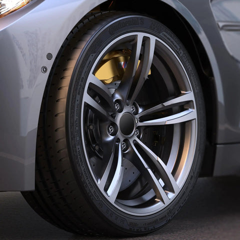 Close-up of car wheel showcasing 10 Piece 1/2-20 Open End Acorn Lug Nuts Set for Trailer Camper RV and Truck Wheels, 60 Degree Conical Seat.