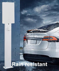 Badass EV Charger Protection Box For Outdoor And Garage Storage, Rain Resistant Heavy Duty Steel Cover near a car in the rain.