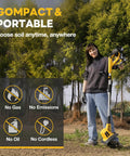 Person holding a 20V Cordless Garden Tiller Rototiller With 360 RPM, 9 Inch Tilling Width in a garden.