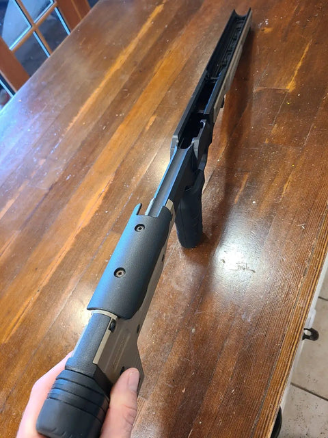 Close-up of Oryx Sportsman Tika T1X SA Right Hand Chassis System Black Rifle Stock on a wooden table.