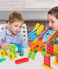 Two kids playing with the Totally Legit 92 Piece Screw Engineering Blocks Set With Sensory Construction Bricks for STEM activities.
