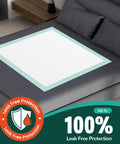 Ultra Thick Disposable Bed Pads With Rock Solid Adhesive Strips 30 X 36 Inches 50 Count on a dark bed covering.