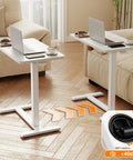 Total Game Changer Over Bed Table With Smooth Rolling Casters And No Sweat Pneumatic Height Adjustment Super Spacious Work Surface for cozy lounge, showcasing adjustable wheels and spacious surface.