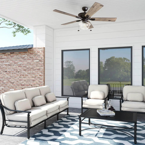 Abner Modern Farmhouse 52 Inch Ceiling Fan With Light in outdoor porch, five-blade bronze finish, stylish seating area