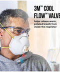 Person wearing All In One N95 Respirator For Sanding Drywall Painting And Woodworking With Exhalation Valve Directing Air Downward