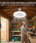 Badass Solar Ceiling Fan With Bright Led Light Pull String Switch Three Speed Modes IP65 Weather Proof Setup Designed For Shed Barn Gazebo Patio Or Coop To Keep Your Backyard Chill Spot Sweet And Breezy Every Day in a shed with tools.