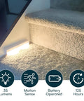 Wireless LED Stair Lights With Motion Sensor, 3 Pack Battery Operated Night Lights illuminating a carpeted stair.