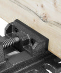 Beefy 3-Inch Drill Press Vise With 3.1 Inch Jaw Opening, 1 Inch Throat, holding a wooden workpiece, cast iron stability