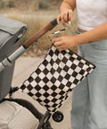 Person attaching Mess-Proof Wet Bag Set 2-Pack Reusable Waterproof Bags For Swimsuits And Baby Clothes On The Go to stroller.