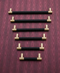 Brushed Satin Gold Bar Cabinet Handle With Black Leather Upholstery 8.5 Inch Overall Length, 7.5 Inch Center-To-Center, 5 Pack on wood