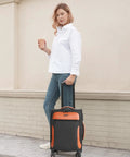 Person with Lightweight 20 Inch Softside Carry On Luggage With Four Spinner Wheels Airline Approved 22 By 14 By 9 TSA Lock Telescoping Handle