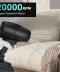 Cordless Handheld Jet Dry Mini Blower Turbo Fan Electric Air Duster used on sofa for car cleaning, home garage, and garden.