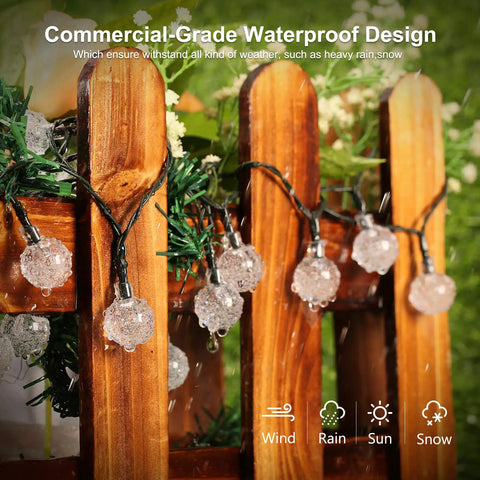 Solar Powered Crystal Globe String Lights 100 LEDs, 72 Ft Outdoor Patio Lights With 8 Modes, Waterproof hanging on wood fence