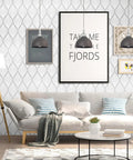 Living room with silver gray peel and stick wallpaper featuring modern boho leaf design, framed art, and cozy sofa setup.