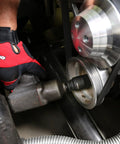 Using Beefy Built Tough Harmonic Balancer Puller Socket Set with crankshaft bolt removal tool on vehicle engine.