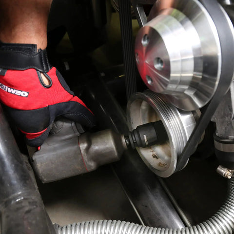 Using Beefy Built Tough Harmonic Balancer Puller Socket Set with crankshaft bolt removal tool on vehicle engine.