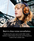 Side view of person wearing OnTrac Noise Cancelling Headphones With Eight Mics, Delivers Up To 40 dB ANC, Copper Finish.