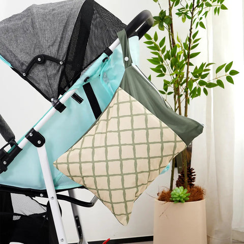 Dual Compartment Wet Dry Bag With Two Zippered Pockets attached to a stroller, featuring a grid pattern, ideal for moms on the go