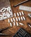 100 Pack Spring Loaded Shutter Repair Pins For Plantation Shutters Replacement Window Tools on a table with pliers and screws
