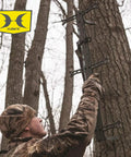 Hunter using Lightweight 30 Inch Aluminum Tree Climbing Sticks 3 Pack For Secure Ascents To Deer Stands Blinds And Tree Stands