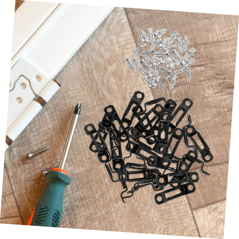 30 Piece Hidden Furniture Connectors Toolless Cabinet Joint Brackets scattered on wood with screws and a screwdriver.