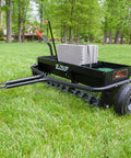 Tow Behind 2-In-1 Lawn Aerator And Spreader With Weight Tray For Extra Penetration Drops Seed Fertilizer Or Lime While Aerating 40-Inch Wide Flat Black on grass